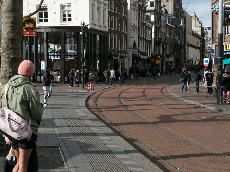 a man that is sitting down in the street