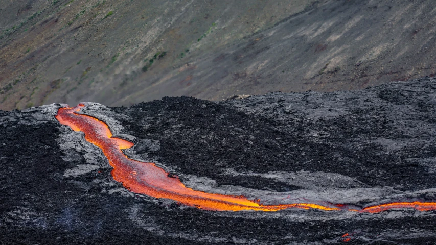 a volcano with lava pouring out of it