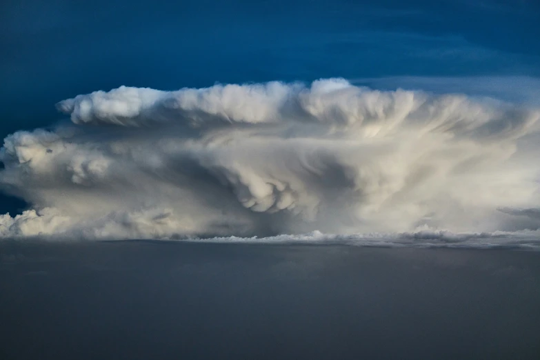 a very large storm that is coming over some water