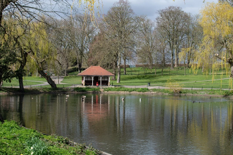 a beautiful gazebo by a calm body of water