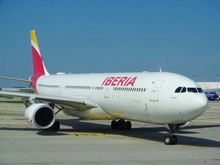 a large plane is parked on the runway