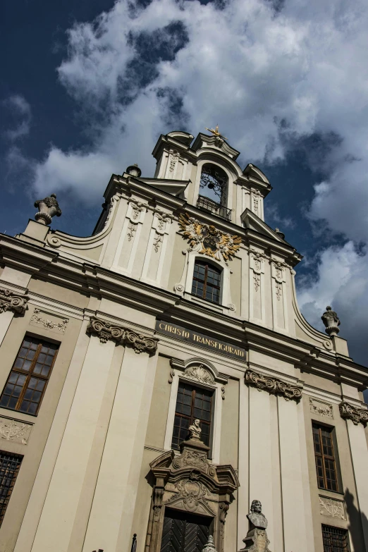 the large tower has statues on each side