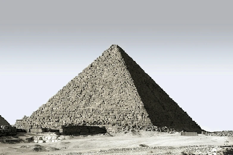 an old pograph of a large pyramid in the desert