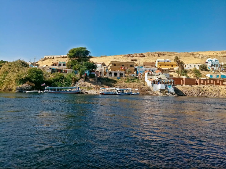 there are many boats that are parked in the water