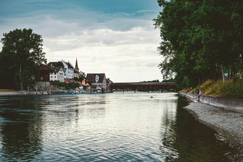 a man and child are swimming on the water