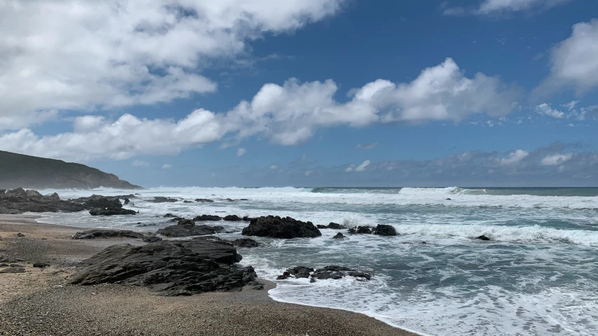 view of water and a beach on a sunny day