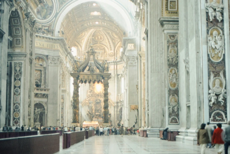 the interior of an ornate church with white marble