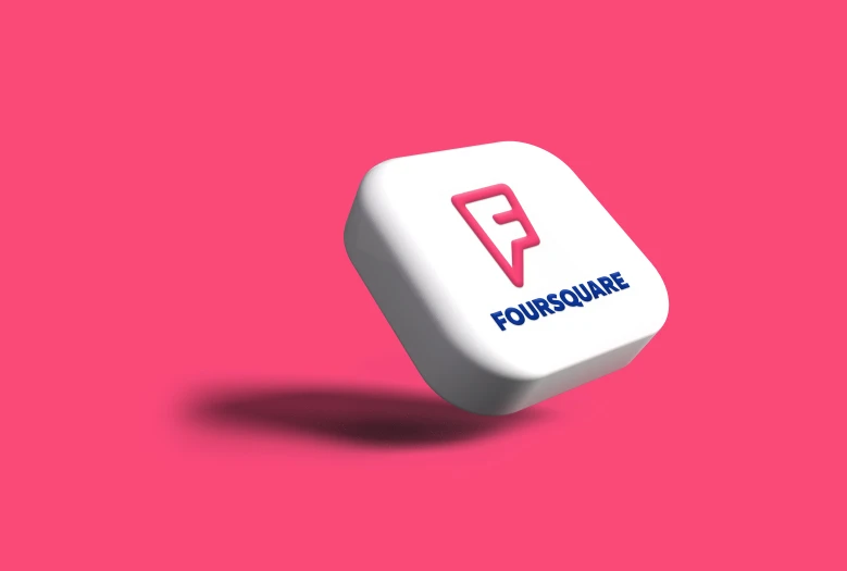 a white and pink object with four square logo