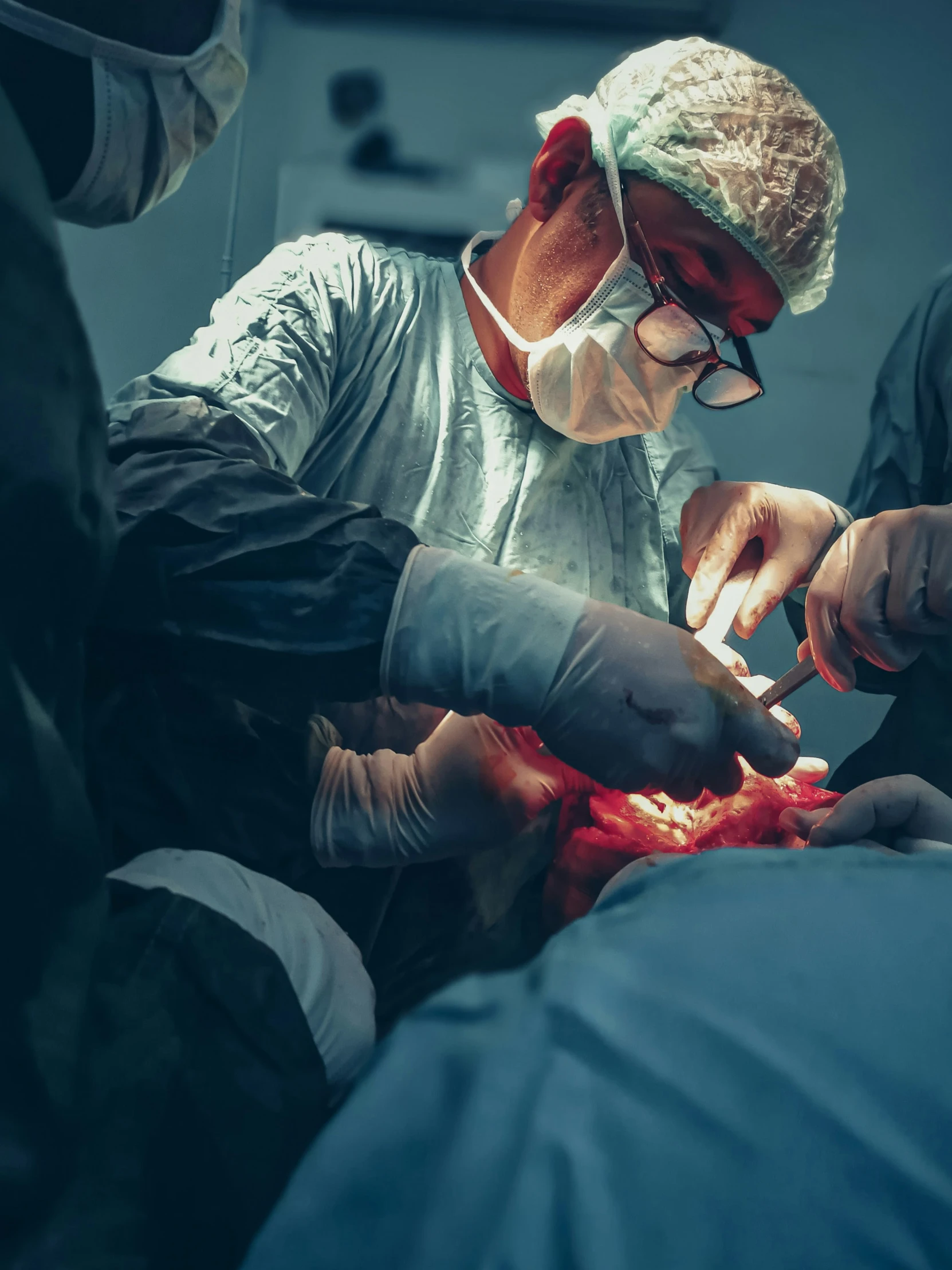 a doctor examines the end of an operating procedure