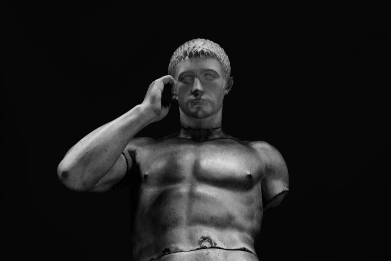 an artistic black and white image of a  man talking on the phone