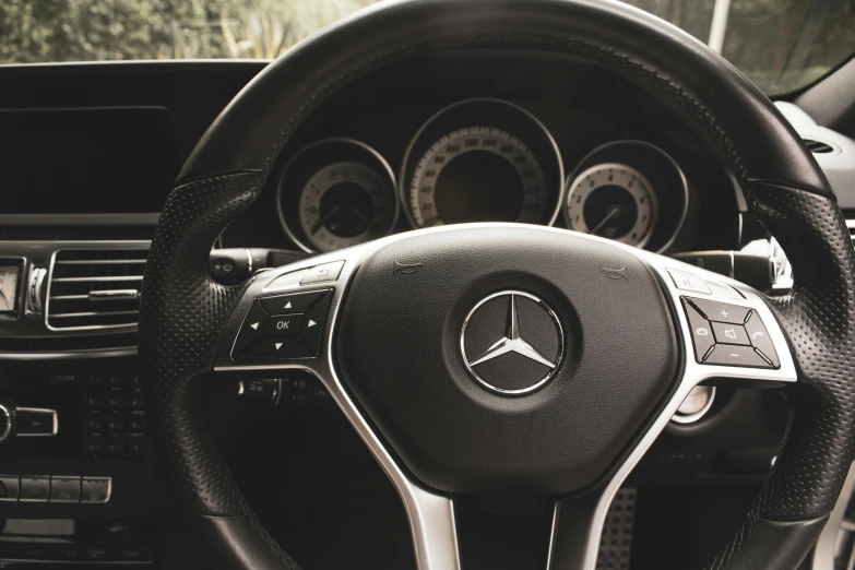 the dashboard and steering wheel of a mercedes benz coupe