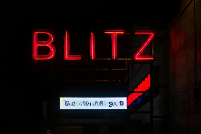 a red lit sign that reads, bluffz the neon