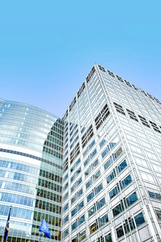 an upward view of a blue and white building