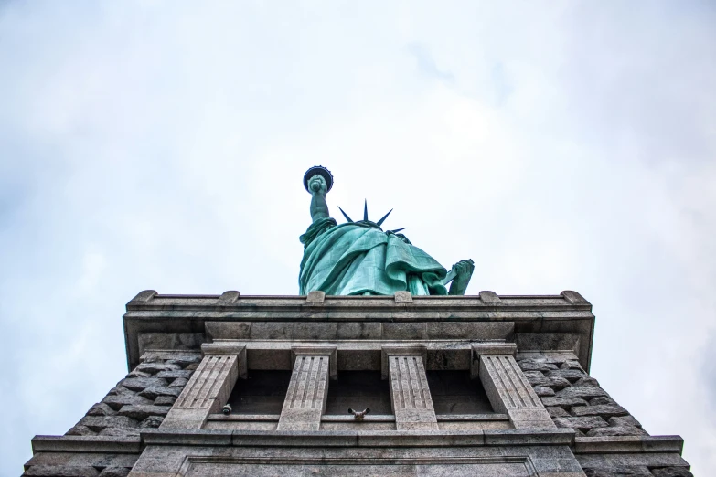 the statue of liberty stands at the top of the building