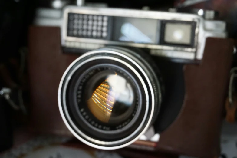 an old camera with a little reflect