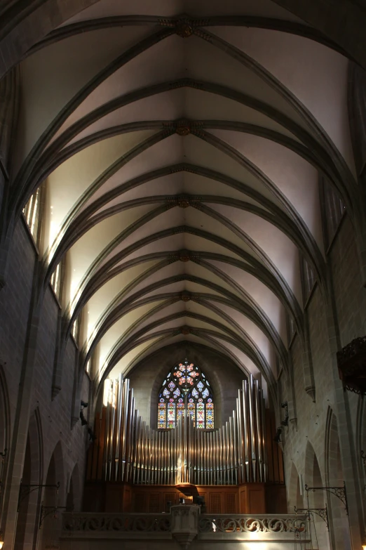 the inside of a church with a stained glass window