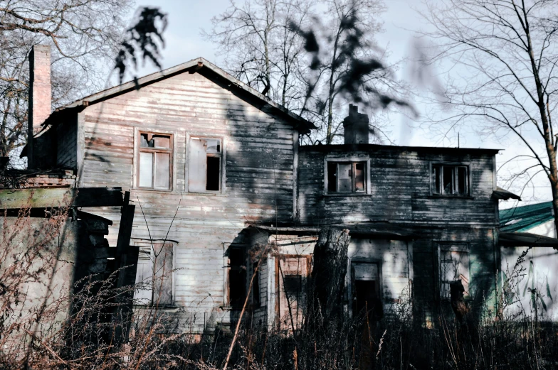 an old run down run down house in the woods