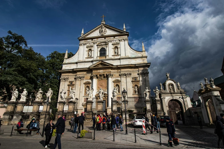 a church is full of people waiting to get into it