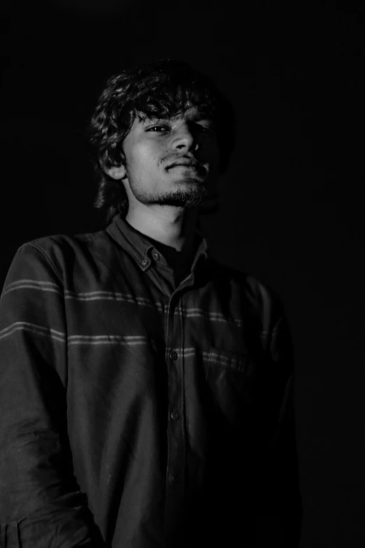 the young man with a mustache in black and white