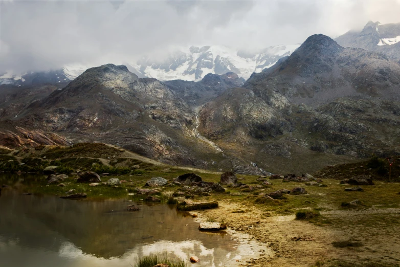 the mountains are covered in white snow