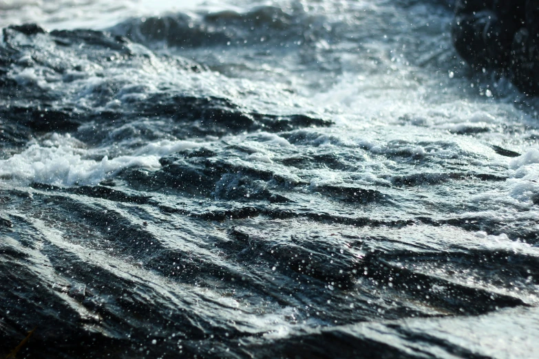 a man in a kayak paddling down the ocean