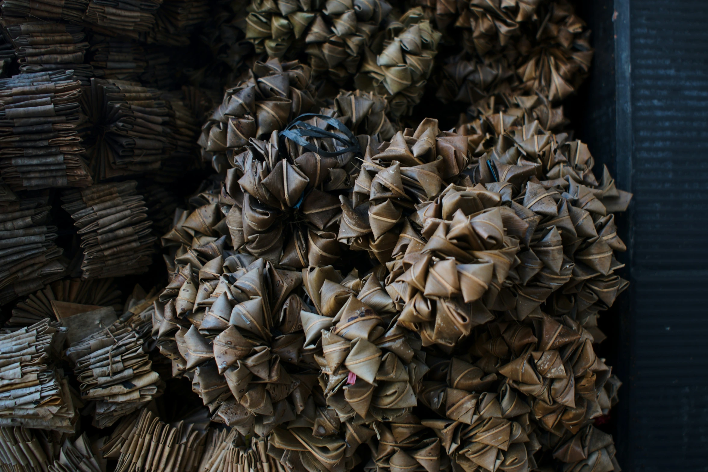 a stack of folded up brown paper near one another