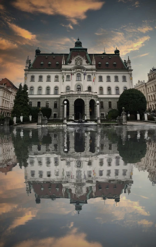 a reflection of the buildings in water