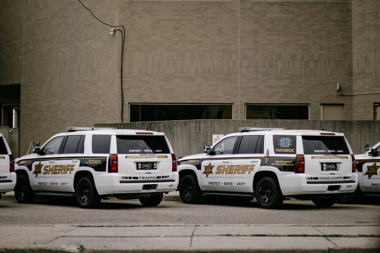 a group of three trucks parked next to each other