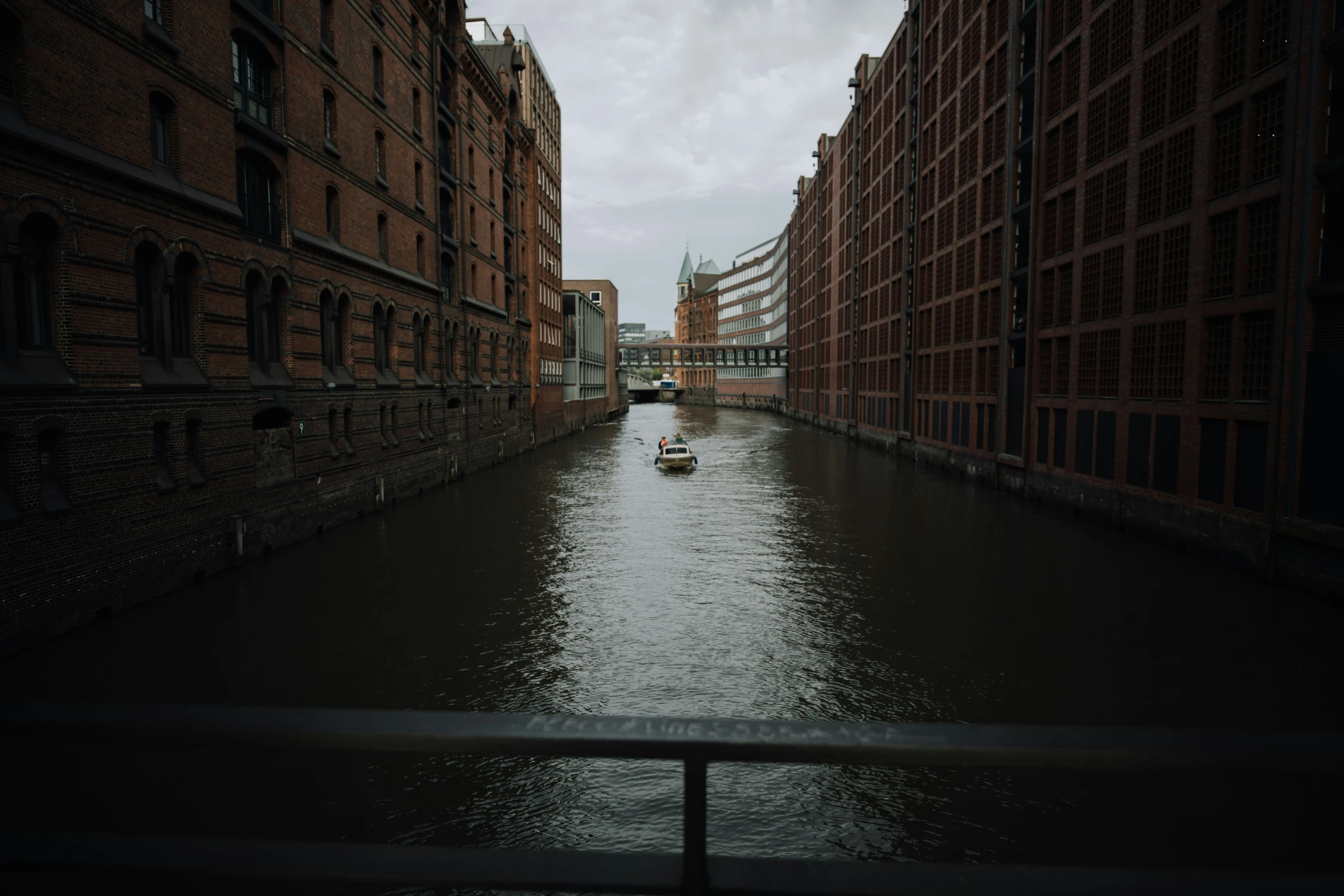 a boat is in the middle of a narrow waterway