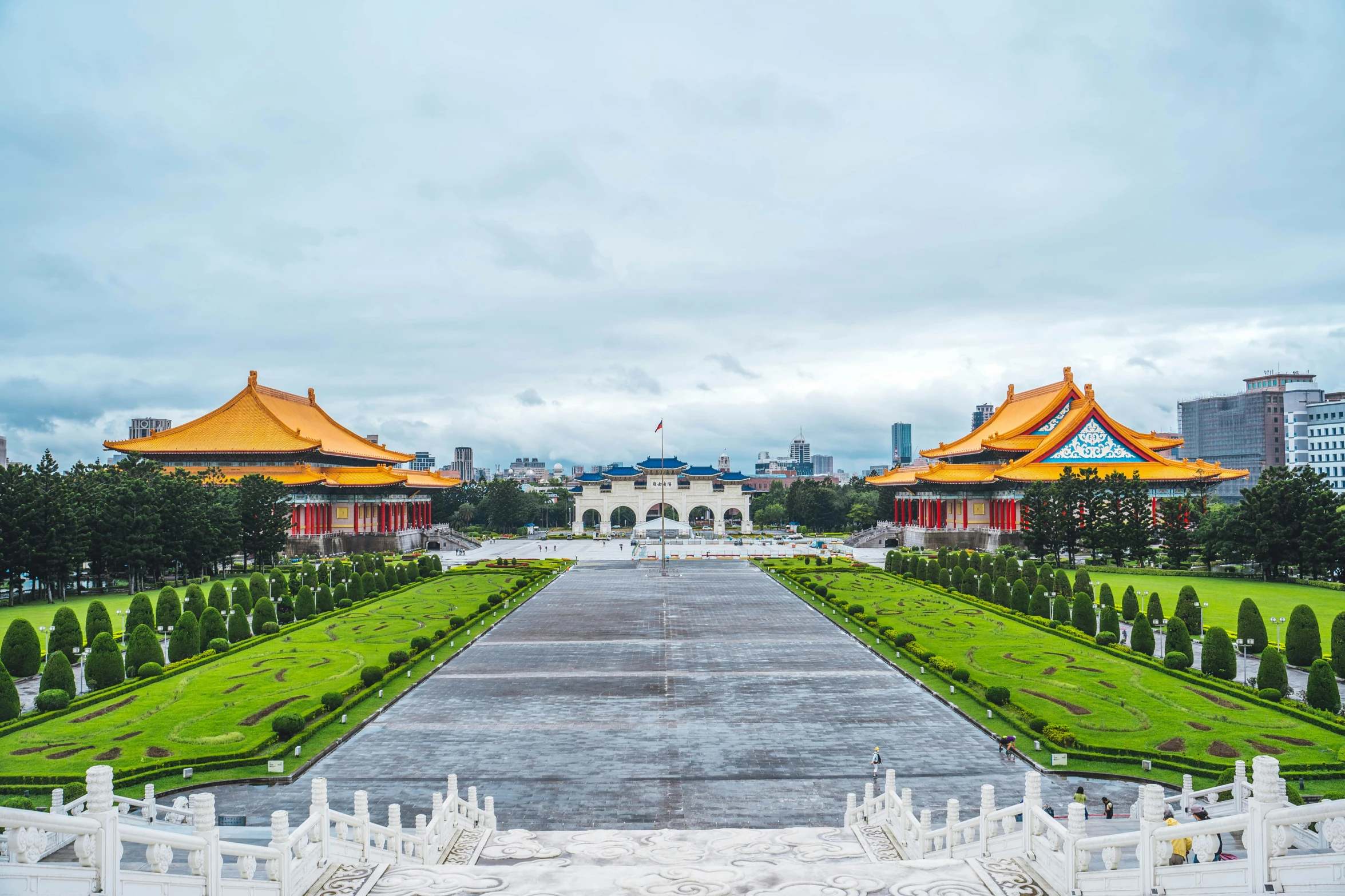 a view of a large garden near a big building