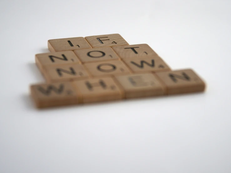 a piece of wood that is made to look like words