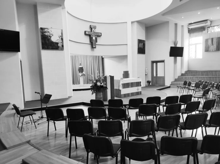 large church auditorium with rows of chairs facing toward the alter