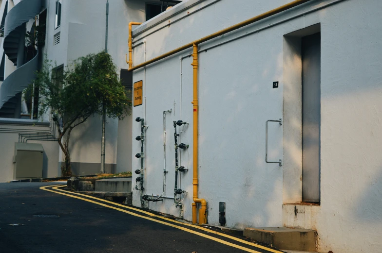 a building with a yellow line next to the road