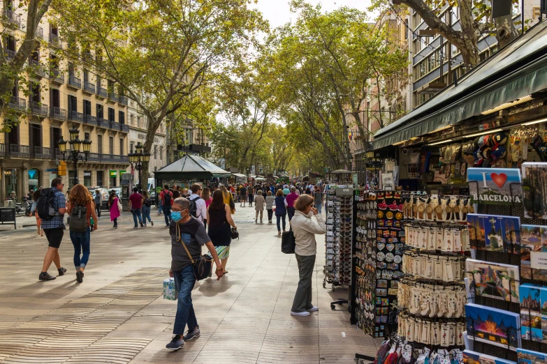 people walking in an open air market area