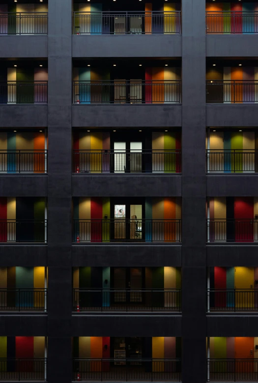 an image of many multi - colored doors in this building