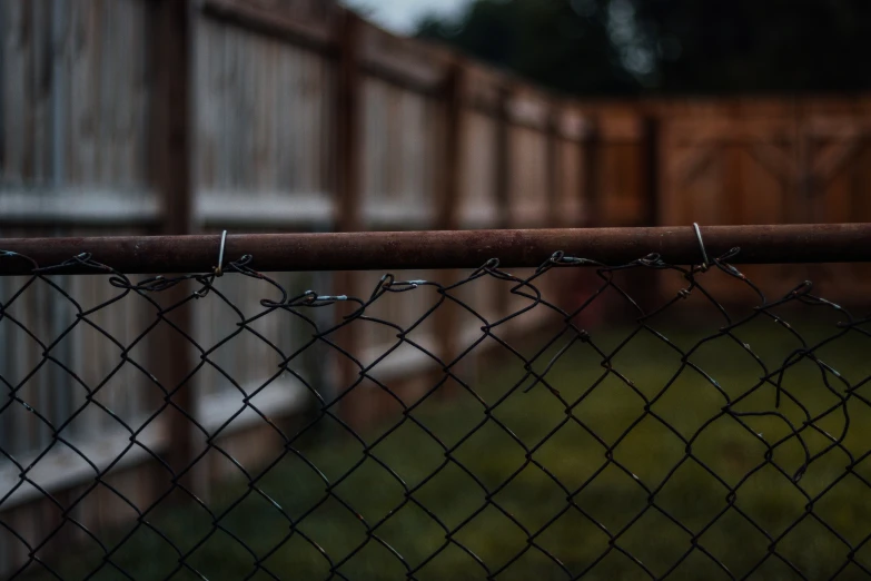 a fence covered in barbed wire is shown