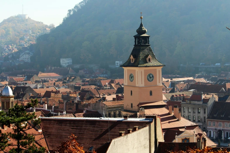 a large clock tower in the middle of a village