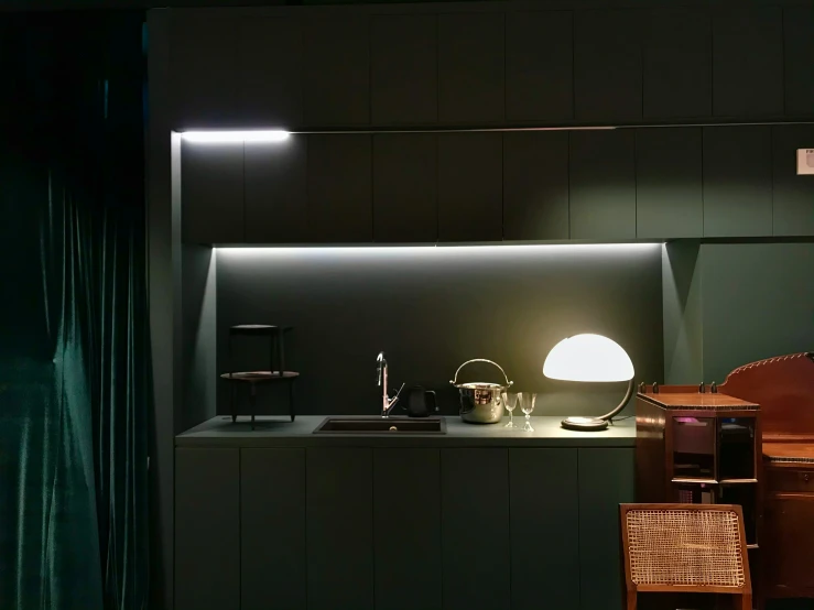 this is a kitchen that has green lighting