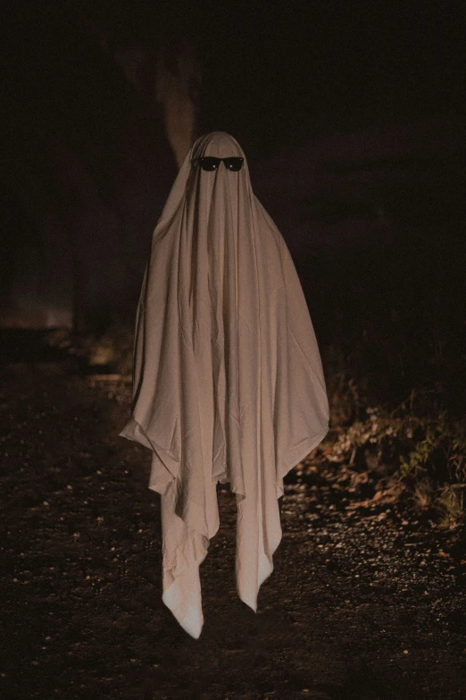 a ghostly figure dressed in a cloth with eyes