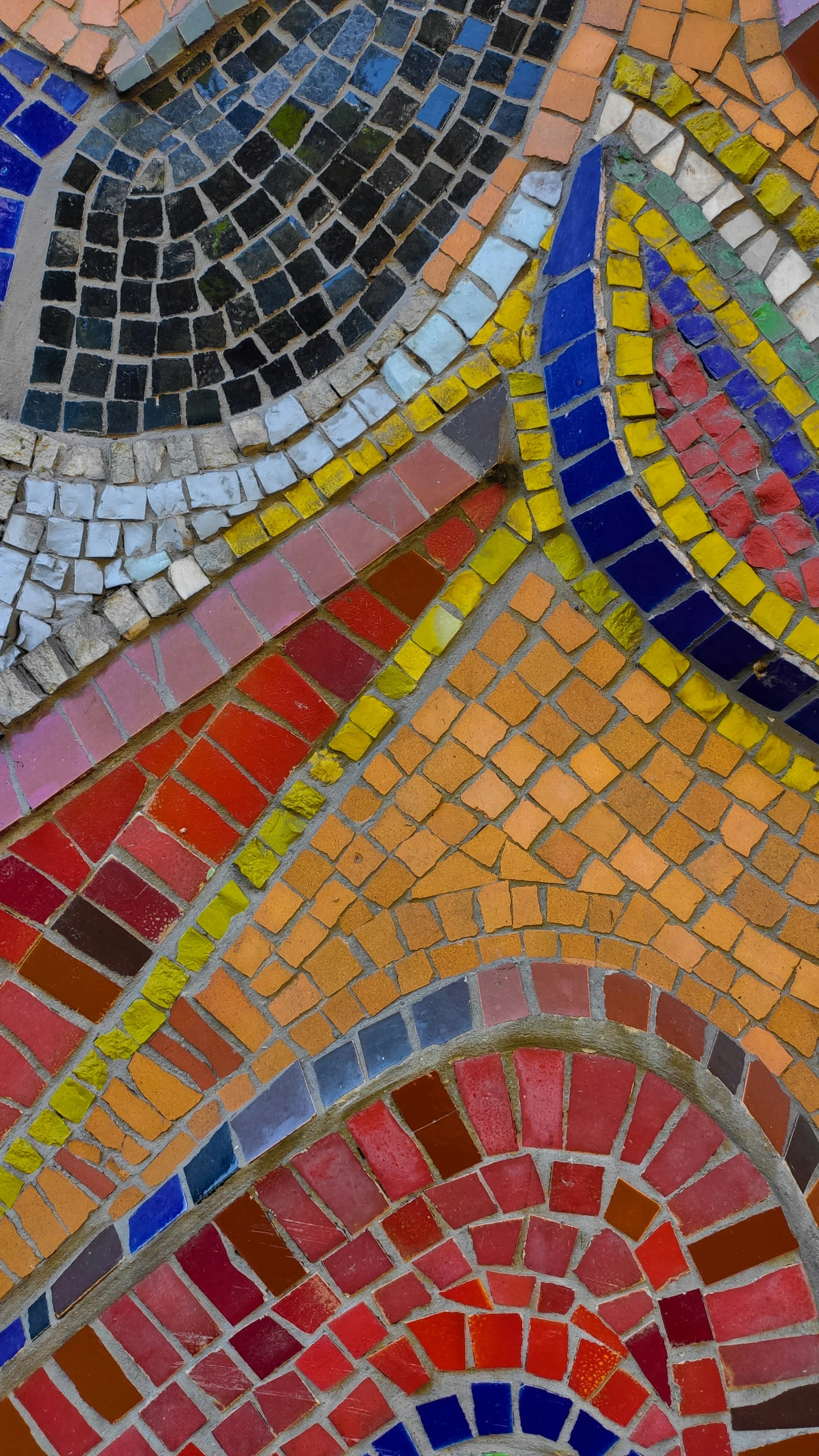 several color tiles are arranged together in a mosaic style