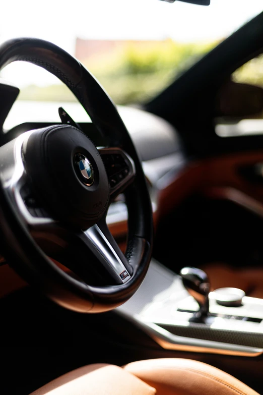 a view of an interior of an automobile in the daylight