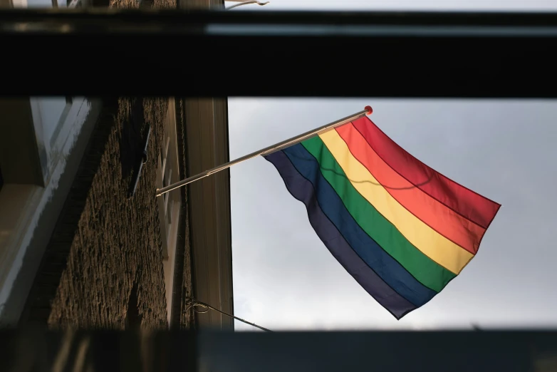 a flag hanging from the side of a building