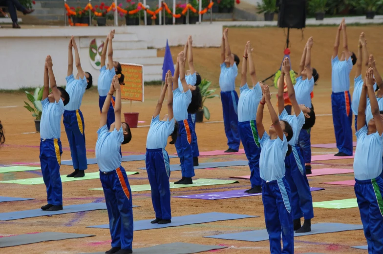 a bunch of women doing yoga and stretching exercises