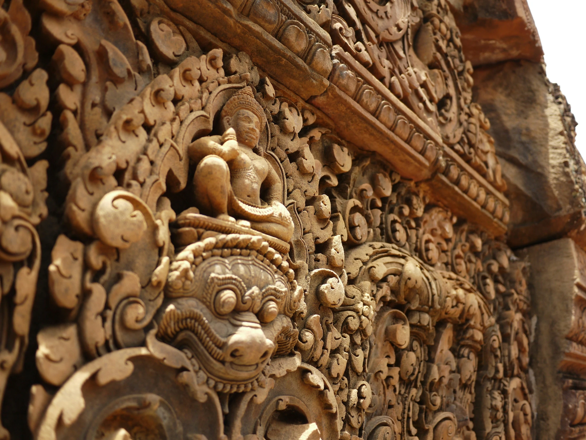 a stone carving of various deities and animals with different designs on it