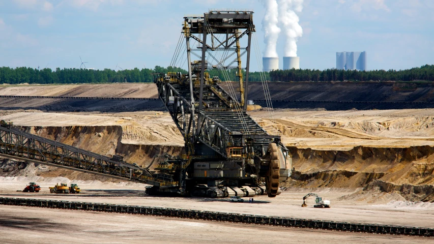 a factory being built by an asphalt plant