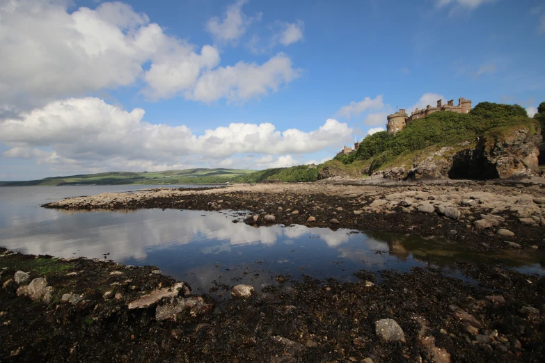 a stone tower sitting above a body of water