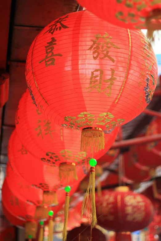 oriental lanterns in a traditional chinese style hang from ceiling