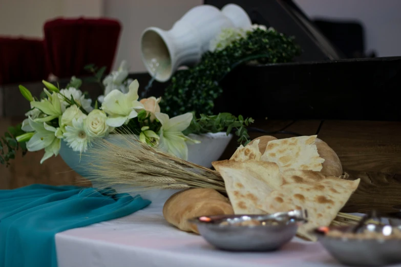 a table filled with plates of food and bowls