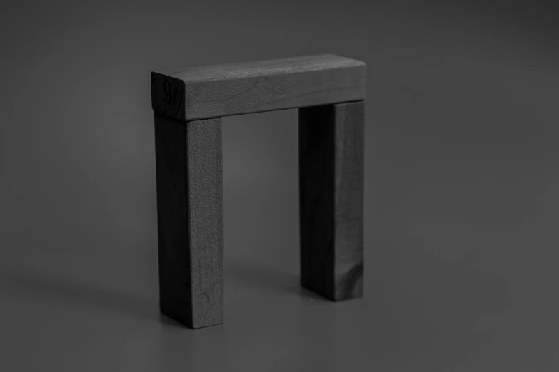there is a square piece of wood on this table