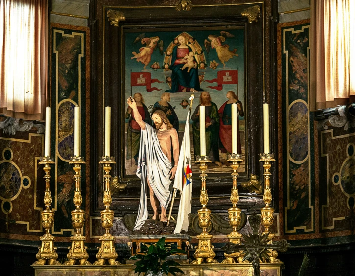 the statue of jesus is in a large ornate church